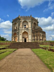Ancient tomb at Bidar, India, showcasing Indo-Islamic architecture under a clear blue sky.