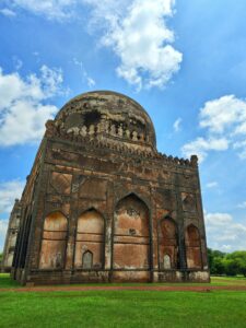 Explore the ancient monument in Bidar, India, showcasing majestic architecture against a vibrant sky.